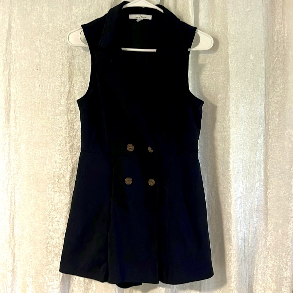 Black romper blazer style. Size Medium. Zip in front with tortoise color buttons